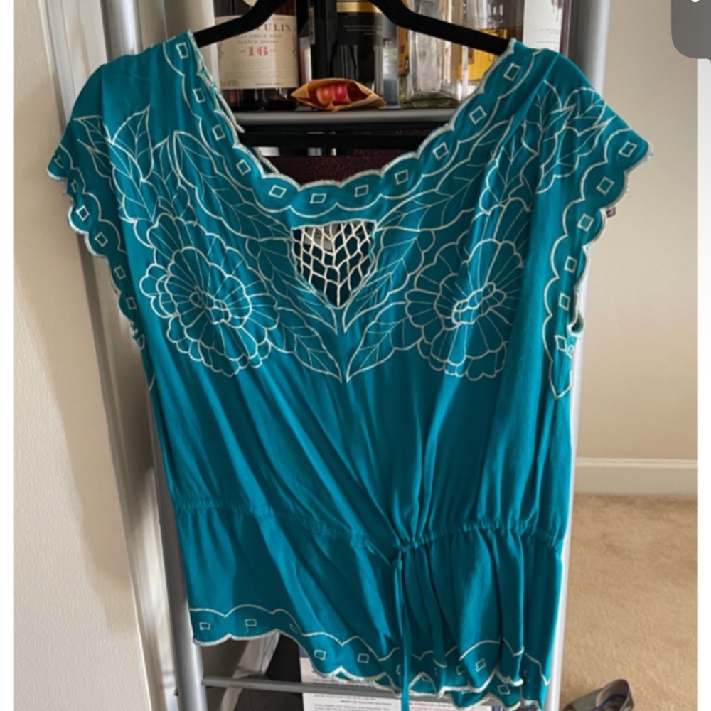 Dark teal top with white floral embroidery
